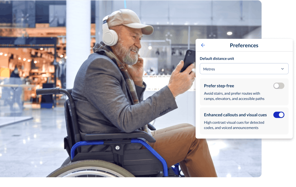 Wheelchair user navigating a shopping centre with the Spaces preferences panel showing a step-free routing preference