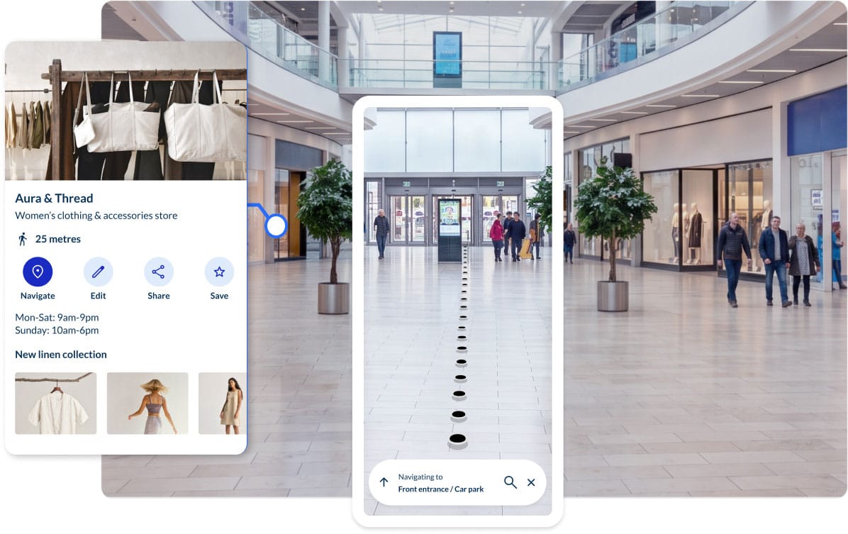 Visitor standing in a museum gallery using a smartphone with the Spaces indoor navigation